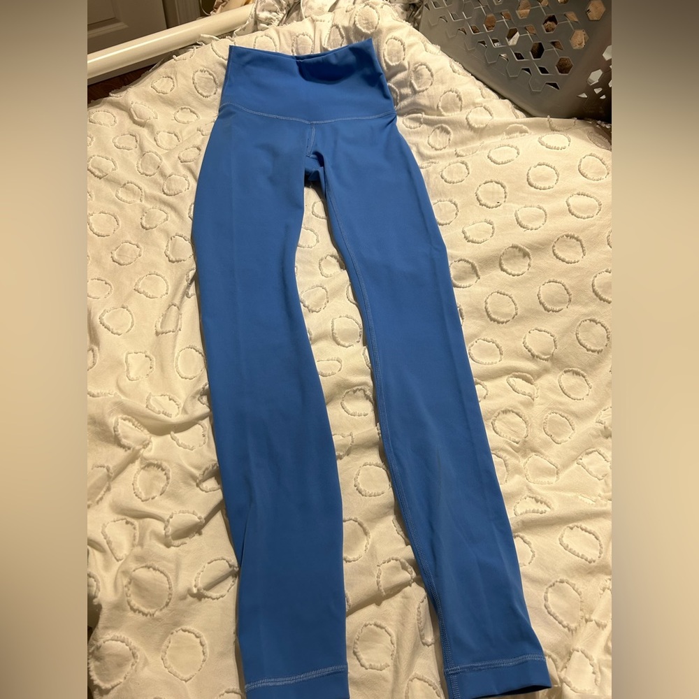 Blue lululemon leggings. Worn gently. In excellent condition. Small stain.